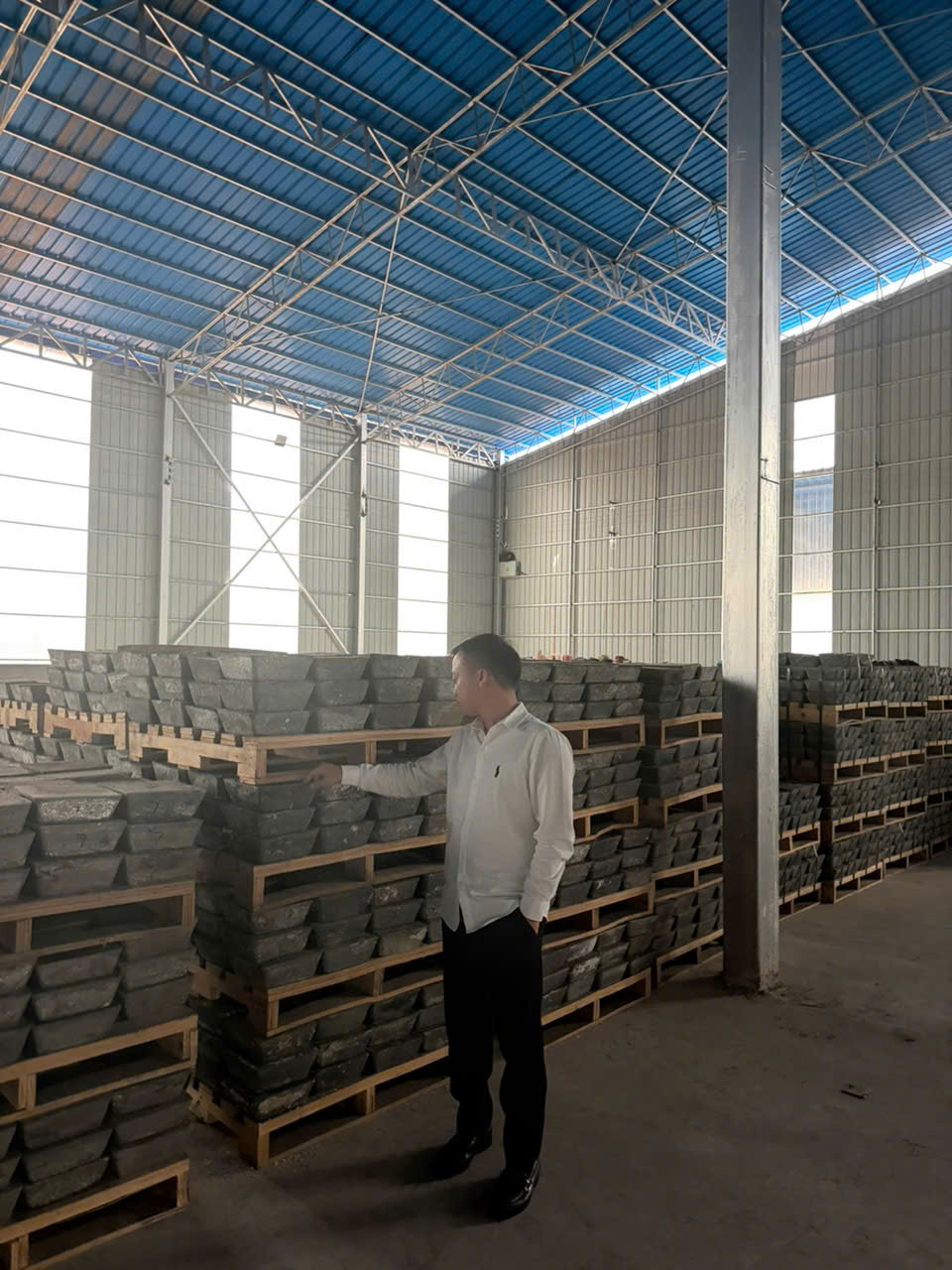 Antimony ingot inventory stacked on pallets inside the Hai An warehouse in Ninh Binh, Vietnam